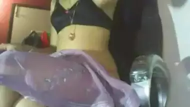 Indian slim girl removing her saree showing her...